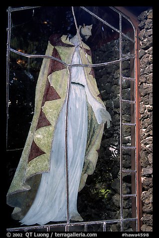 A stained glass with Jesus in traditional hawaiian robe, Palapala Hoomau church. Maui, Hawaii, USA