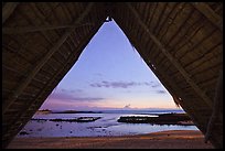 Aiopio fishtrap framed by Halau at dusk, Kaloko-Honokohau National Historical Park. Hawaii, USA ( color)