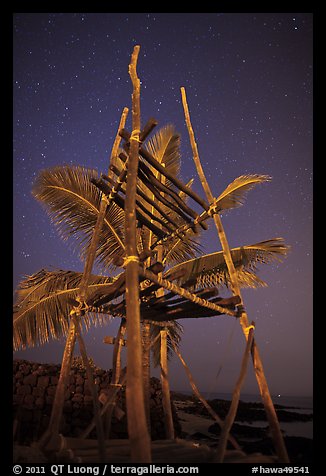 Altar and palm tree at night, Kaloko-Honokohau National Historical Park. Hawaii, USA