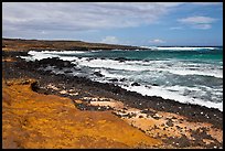 Colorful shale and ocean with surf, South Point. Big Island, Hawaii, USA