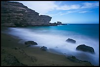 Blurred waves and cliff, Papakolea Beach. Big Island, Hawaii, USA