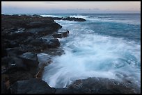 Surf and lava shoreline at sunset, South Point. Big Island, Hawaii, USA