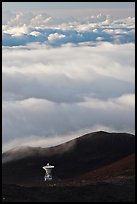 Astronomic radio antenna and sea of clouds. Mauna Kea, Big Island, Hawaii, USA