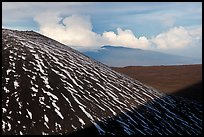 Cinder cone with snow stripes, distant clouds. Mauna Kea, Big Island, Hawaii, USA (color)