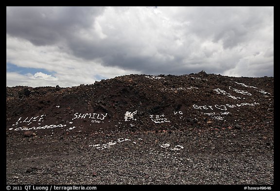 Words made with light rocks against dark lava rocks. Big Island, Hawaii, USA