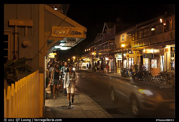 Tourists strolling store-lined street at night. Lahaina, Maui, Hawaii, USA (color)