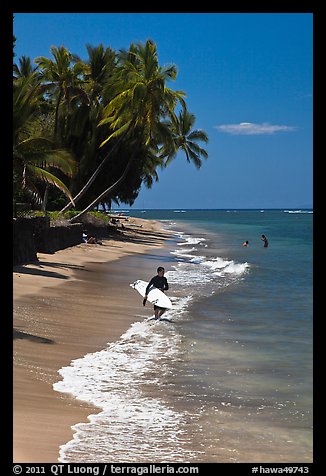 Surfer walking on beach. Lahaina, Maui, Hawaii, USA (color)