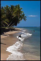 Surfer walking on beach. Lahaina, Maui, Hawaii, USA (color)