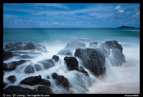 Rock with water motion and Mokuaeae island. Kauai island, Hawaii, USA (color)