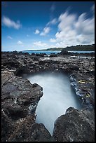 Surf in blowhole, Mokolea lava shelf. Kauai island, Hawaii, USA (color)