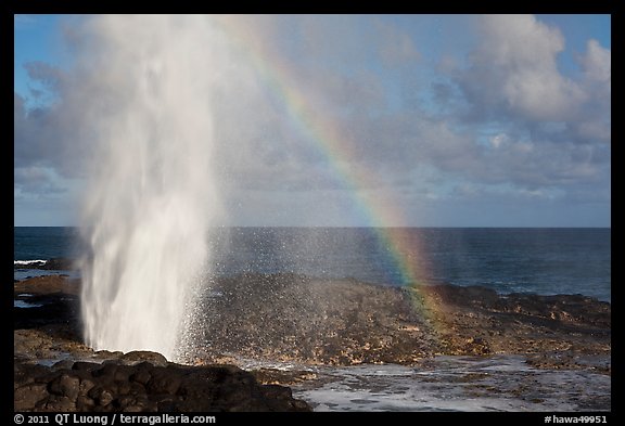 Spouting Horn with rainbow, late afternoon. Kauai island, Hawaii, USA