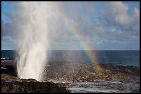 Spouting Horn with rainbow, late afternoon. Kauai island, Hawaii, USA