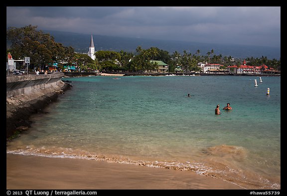 Beach, seawall and town, Kailua-Kona. Hawaii, USA