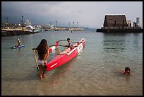 Girls, outrigger canoe, and Kamakahonu heiau, Kailua-Kona. Hawaii, USA (color)