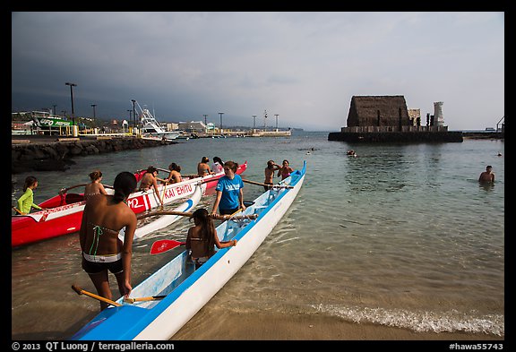 Kamakahonu Beach with outrigger canoeists, Kailua-Kona. Hawaii, USA (color)