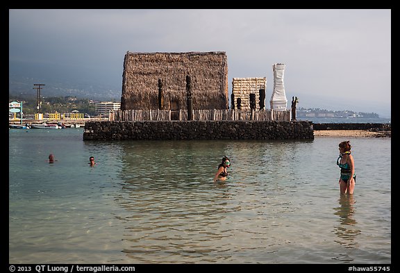 Women snorkling and Kamakahonu heiau, Kailua-Kona. Hawaii, USA (color)