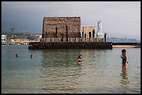 Women snorkling and Kamakahonu heiau, Kailua-Kona. Hawaii, USA ( color)