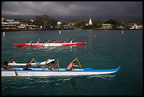 Outrigger canoes and town under storm sky, Kailua-Kona. Hawaii, USA ( color)