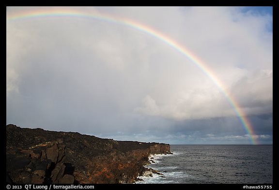 Rainbow over volcanic costline. Big Island, Hawaii, USA