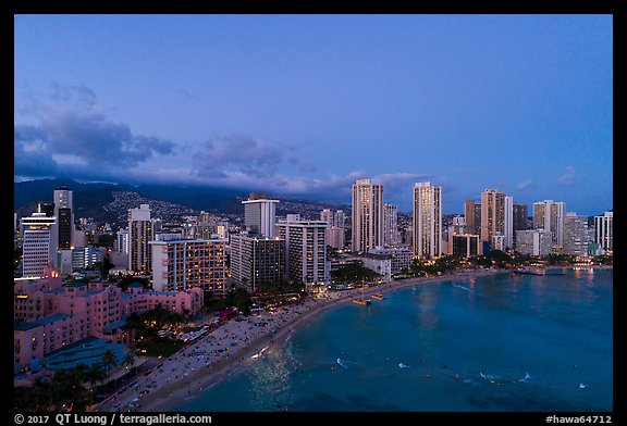 Aerial view of Waikiki Beach and skyline at dusk. Honolulu, Oahu island, Hawaii, USA (color)