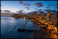 Aerial view of Kuhio Beach, skyline at dusk. Honolulu, Oahu island, Hawaii, USA ( color)