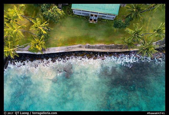 Aerial view of Hulihee Palace, palm trees, and coastline. Hawaii, USA (color)