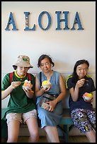 Family with Hawaiian Shave Ice under Aloaha letters, Paia. Maui, Hawaii, USA ( color)