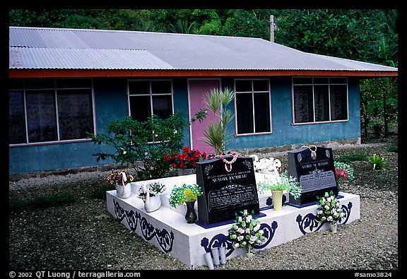 Tombs in front of a home in Faleasao. American Samoa (color)