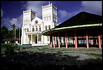 Church and fale in Leone. Tutuila, American Samoa (color)