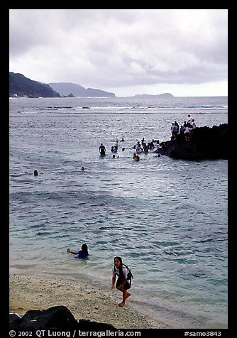 Children playing in water near Fugaalu. Pago Pago, Tutuila, American Samoa