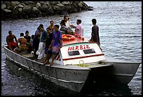 Villagers crowd a ferry to Aunuu. Aunuu Island, American Samoa (color)