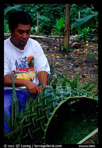 Villager weaving a basket out of a single palm leaf. Tutuila, American Samoa