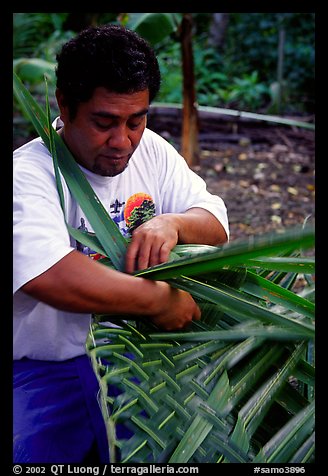 Villager weaving a basket out of a single palm leaf. Tutuila, American Samoa