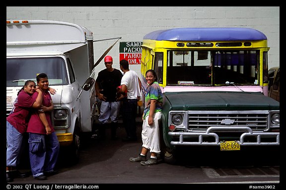 People and colorful buses. Pago Pago, Tutuila, American Samoa