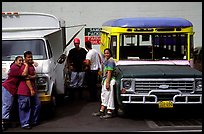 People and colorful buses. Pago Pago, Tutuila, American Samoa