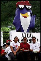 Women in front of statue of Charlie the Tuna. Pago Pago, Tutuila, American Samoa