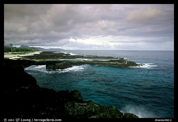 Balsalt rocks on the Vaitogi coast, site of the Shark and Turtle legend. Tutuila, American Samoa (color)