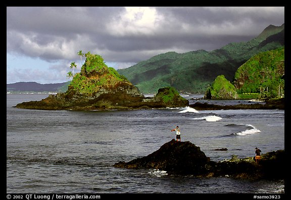 Fishermen on the rocky shore near Maa Kamela. Tutuila, American Samoa (color)