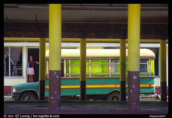 Bus and fale in Masefau village. Tutuila, American Samoa