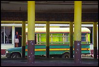 Bus and fale in Masefau village. Tutuila, American Samoa