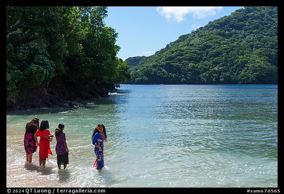 Samoan women standing in water in Fagasa Bay. Tutuila, American Samoa (color)