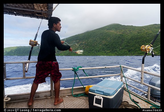 Samoan man fishing on alia boat. American Samoa (color)