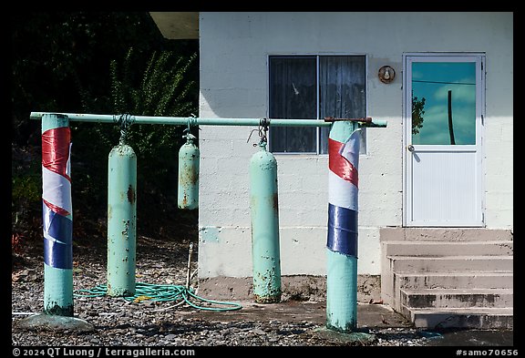 Scuba tanks used as curfew bells, Fagamalo. Tutuila, American Samoa (color)