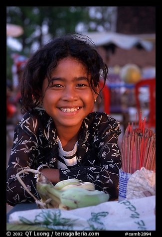 Young incense vendor. Phnom Penh, Cambodia (color)