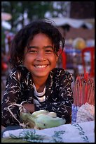 Young incense vendor. Phnom Penh, Cambodia