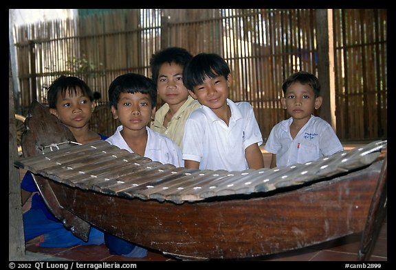 Boys with a traditional musical instrument. Phnom Penh, Cambodia (color)