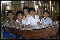 Boys with a traditional musical instrument. Phnom Penh, Cambodia (color)
