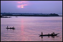 Boats at sunrise, Tonle Sap river,  Phnom Phen. Cambodia