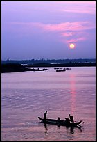 Boat and sunrise, Tonle Sap,  Phnom Phen. Cambodia