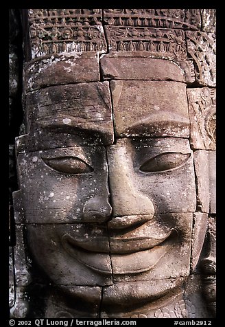 Enigmatic stone smiling face, the Bayon. Angkor, Cambodia (color)